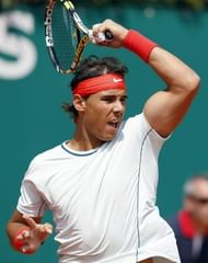 Spain's Rafael Nadal hits a return to Australia's Marinko Matosevic on April 17, 2013